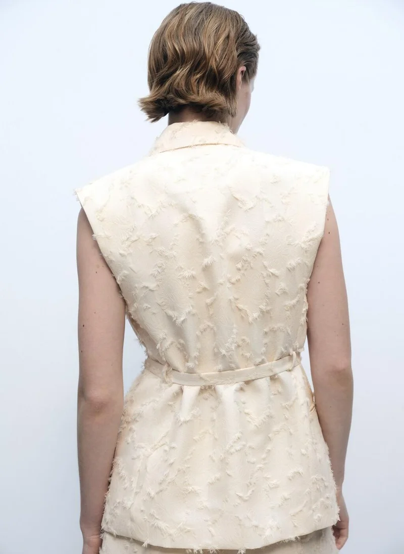 مانجو صدرية بخصر بحزام